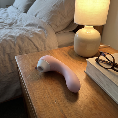 Moodie Bloom on the nightstand beside a lamp